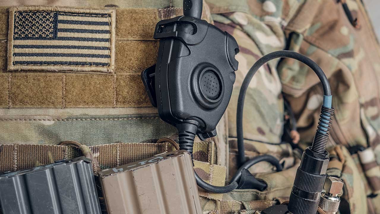 man on headset in command center